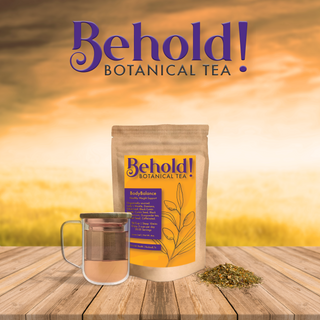 Bag of healthy weight promoting tea next to a glass of tea and organic botanicals
