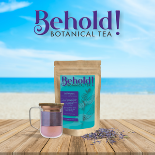 Bag of anxiety alleviating tea next to a glass of tea and organic botanicals